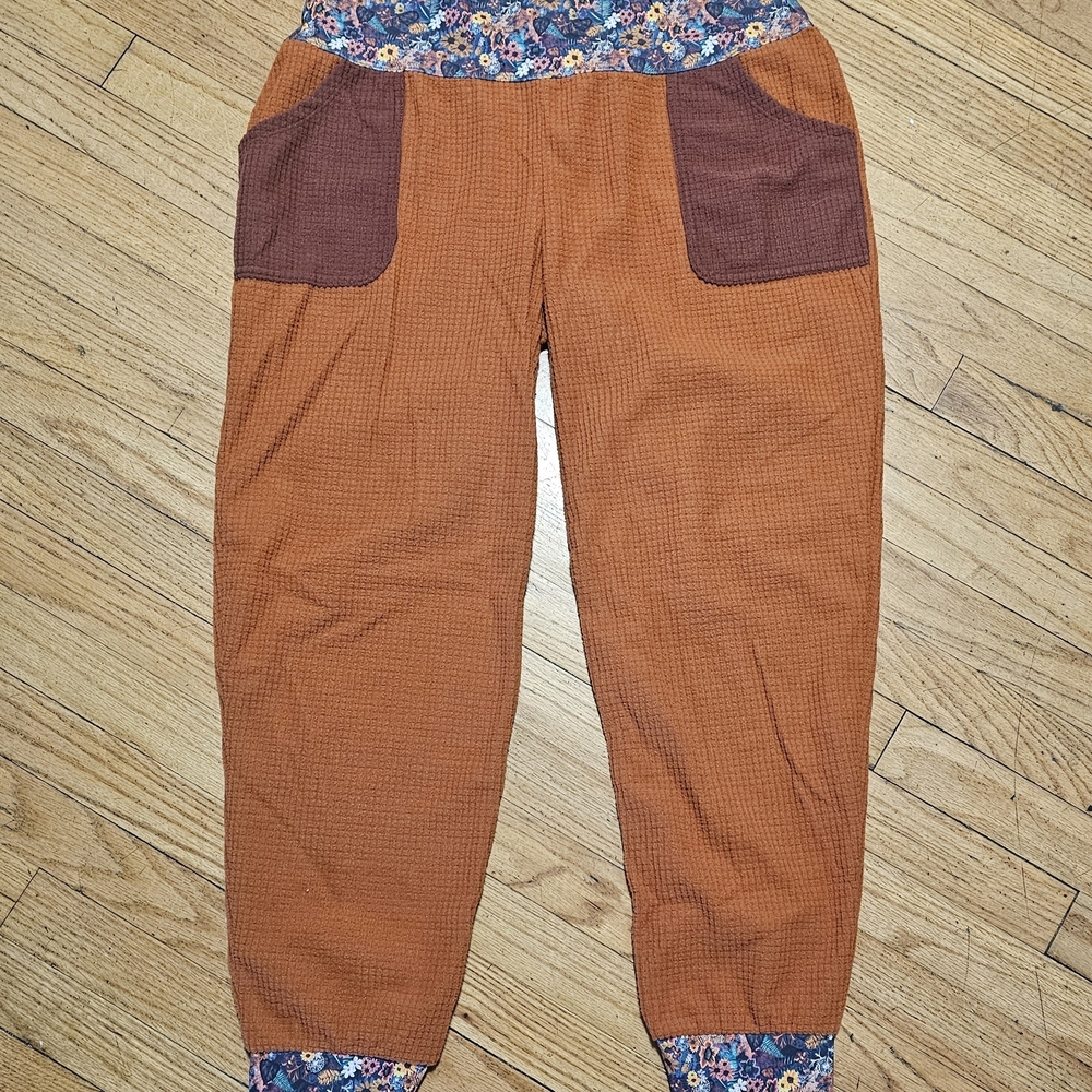 Orange Textured Pants with Floral Accents